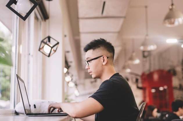 an-asian-man-working-with-laptop-in-a-creative-and-modern-office_t20_P0oBKR